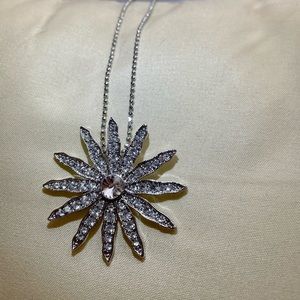Necklace with flower crystal medallion.